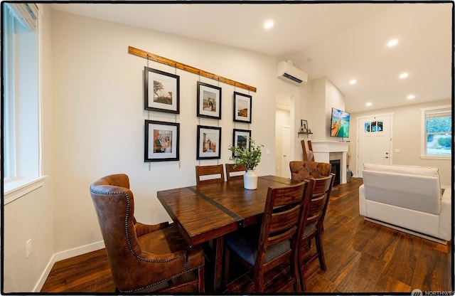 dining space featuring lofted ceiling, dark hardwood / wood-style floors, and a wall mounted AC