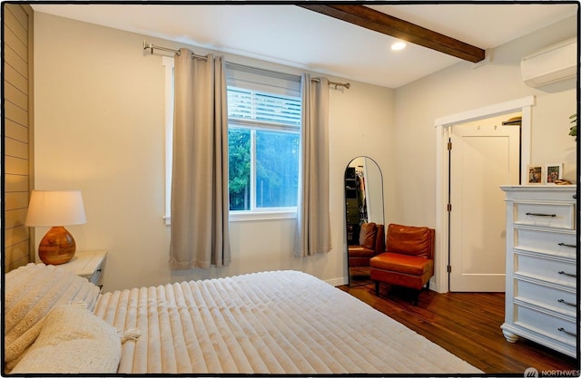 bedroom with beam ceiling, dark wood-type flooring, and a wall unit AC