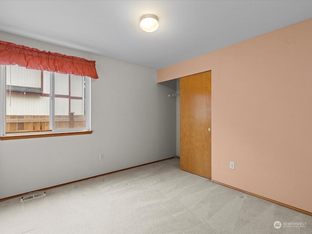 spare room with light carpet