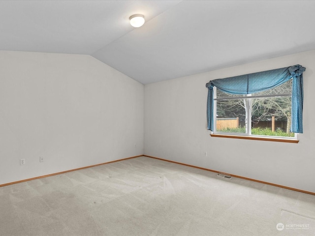 bonus room with lofted ceiling and carpet floors