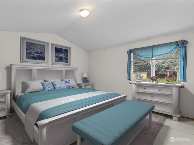 carpeted bedroom featuring vaulted ceiling