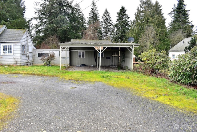 view of front of property featuring a carport