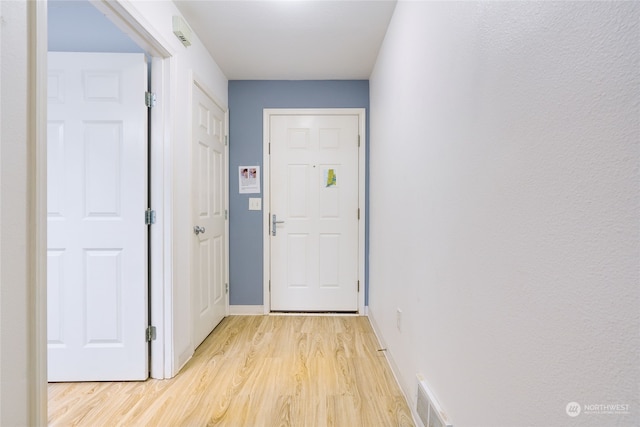 entryway with light hardwood / wood-style floors