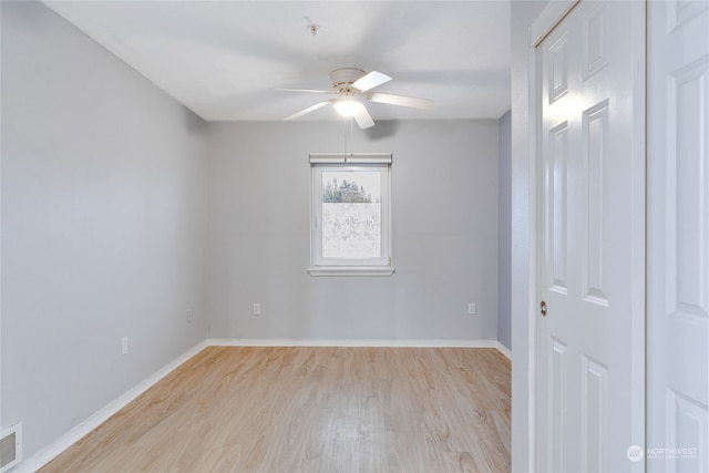 empty room featuring light hardwood / wood-style flooring and ceiling fan