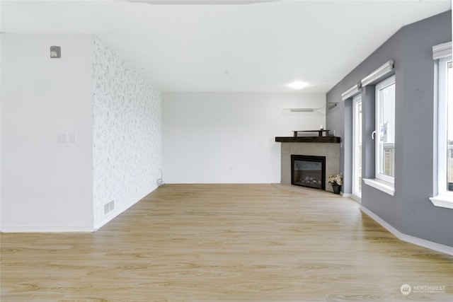 unfurnished living room featuring light hardwood / wood-style flooring