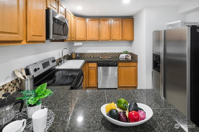 kitchen with sink and appliances with stainless steel finishes