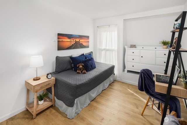 bedroom with light hardwood / wood-style flooring