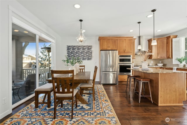 dining space with an inviting chandelier, baseboards, dark wood finished floors, and recessed lighting