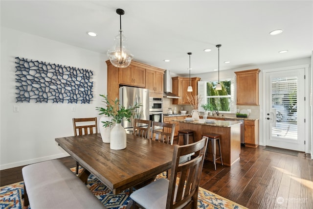 dining room featuring dark wood-type flooring, recessed lighting, and baseboards