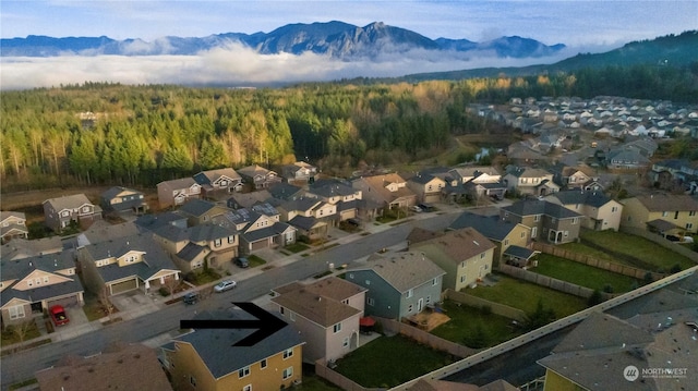 birds eye view of property with a residential view and a mountain view