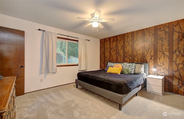 bedroom featuring ceiling fan and light carpet