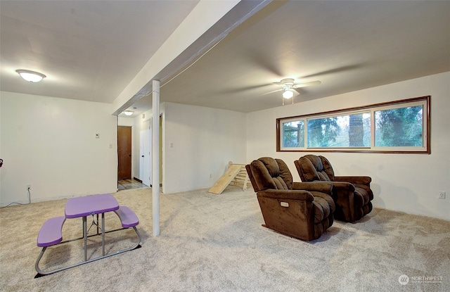 carpeted living room featuring ceiling fan