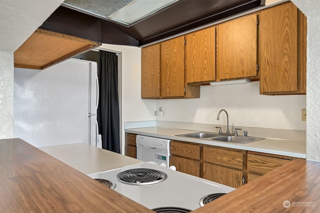 kitchen featuring sink and white appliances