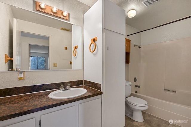 full bathroom with shower / tub combination, tile patterned flooring, vanity, a textured ceiling, and toilet