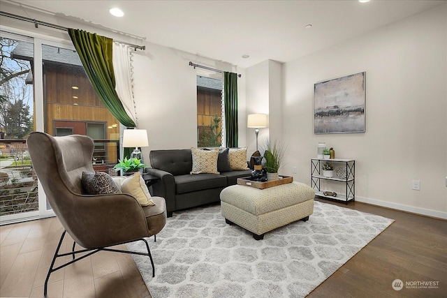 sitting room with wood-type flooring