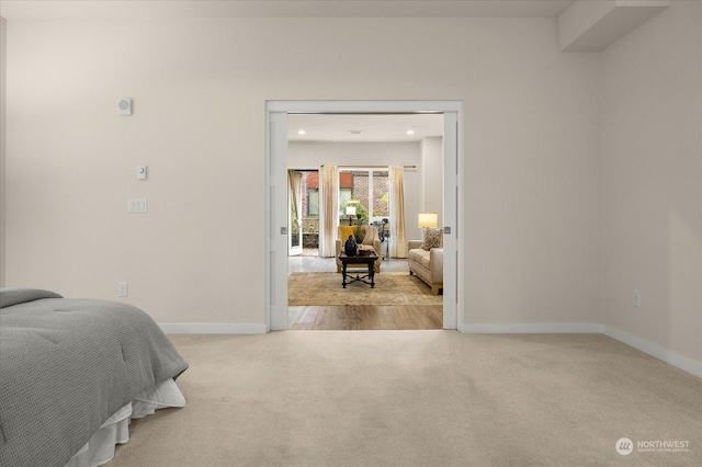 bedroom with light colored carpet