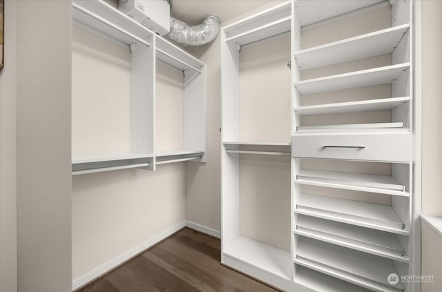 walk in closet featuring dark hardwood / wood-style floors