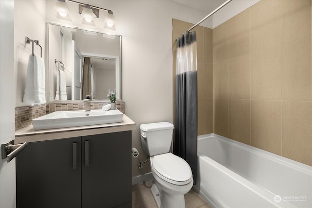 full bathroom featuring tasteful backsplash, vanity, shower / bathtub combination with curtain, and toilet