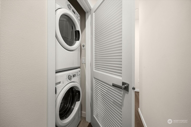 laundry room featuring stacked washing maching and dryer