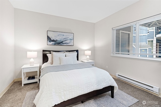 carpeted bedroom featuring baseboard heating