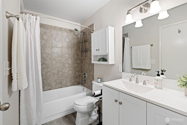 full bathroom featuring vanity, hardwood / wood-style floors, shower / bath combination with curtain, and toilet