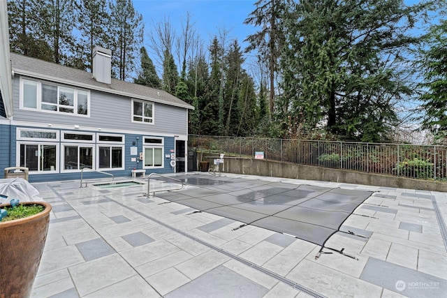 view of swimming pool with a patio