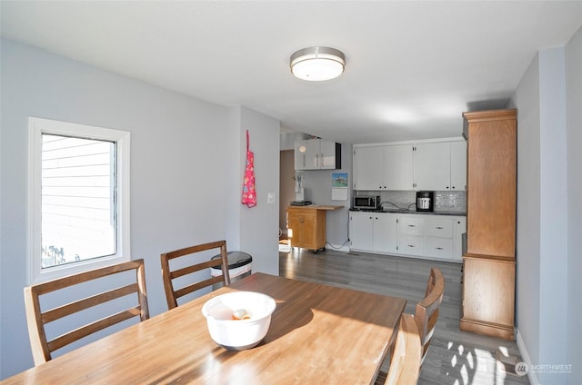 dining room with dark wood-type flooring