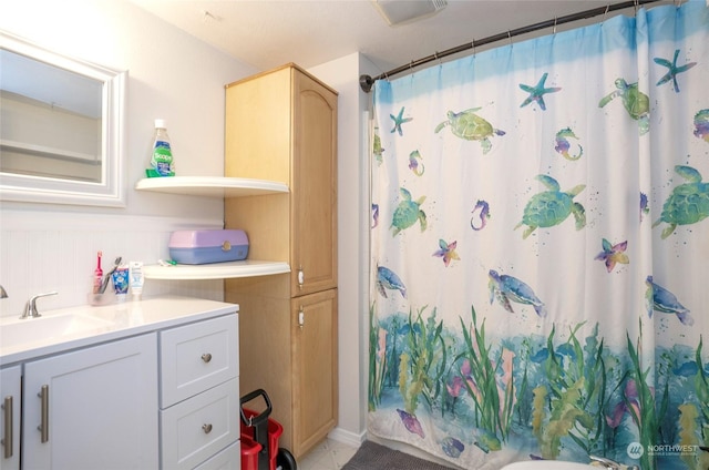 bathroom with sink and a shower with curtain