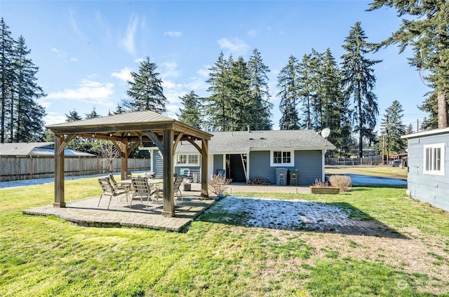 back of house featuring a yard, a gazebo, and a patio