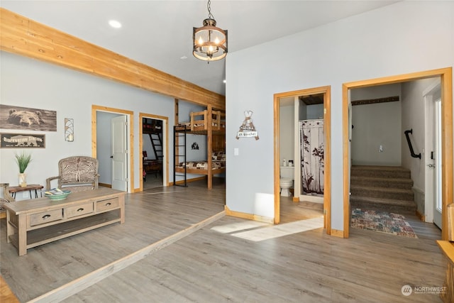 foyer with wood-type flooring and a chandelier