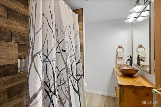 bathroom with vanity and hardwood / wood-style floors