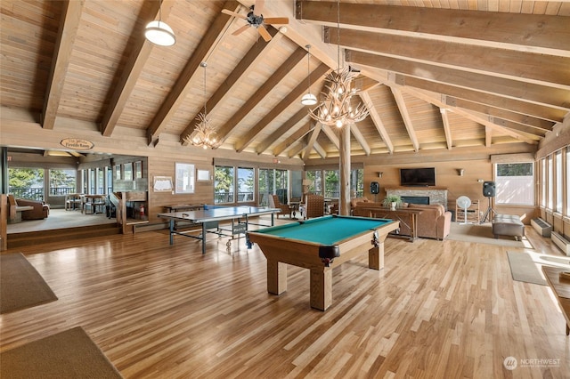 playroom with hardwood / wood-style flooring, a healthy amount of sunlight, and a fireplace