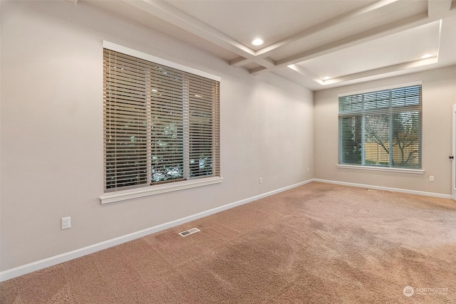 empty room featuring carpet, recessed lighting, visible vents, coffered ceiling, and baseboards