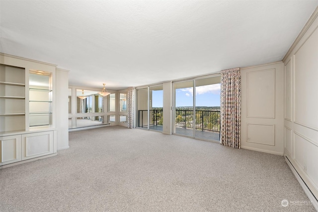 unfurnished living room featuring a wall of windows, light colored carpet, and baseboard heating