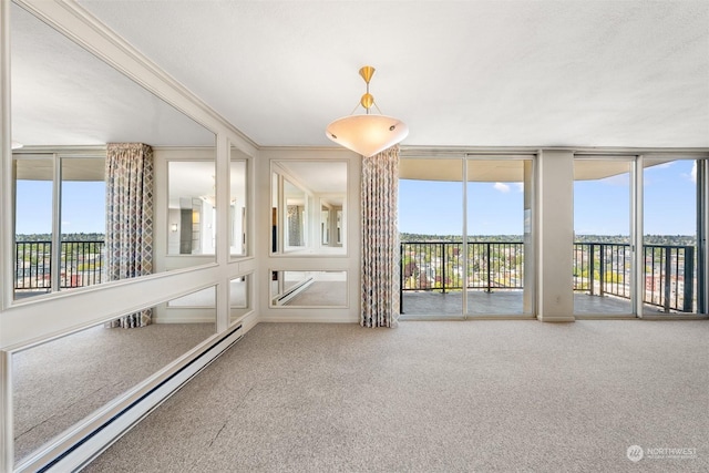 unfurnished sunroom featuring a healthy amount of sunlight and a baseboard heating unit