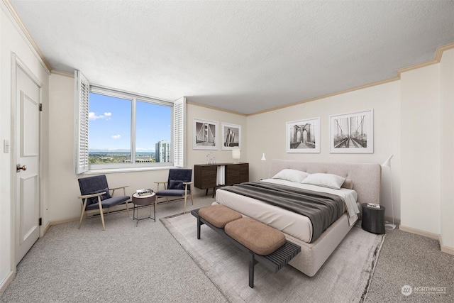 bedroom with ornamental molding, carpet floors, and a textured ceiling