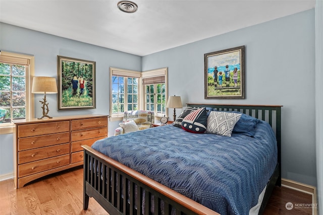 bedroom with wood-type flooring