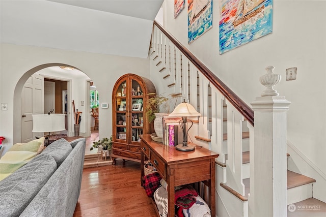 stairs featuring hardwood / wood-style floors