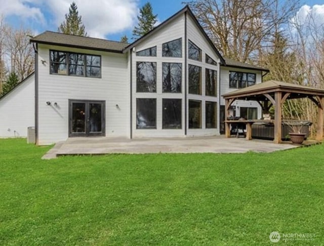 23415 152nd Ave E, Graham, WA 98338 - rear view of property with a patio area, a gazebo, a hot tub, and a yard