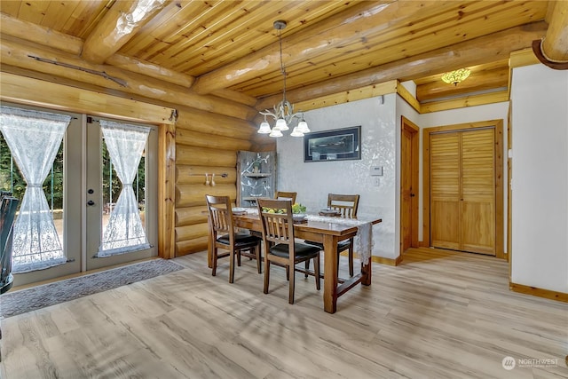 dining space with beamed ceiling, a notable chandelier, wooden ceiling, light wood-type flooring, and french doors