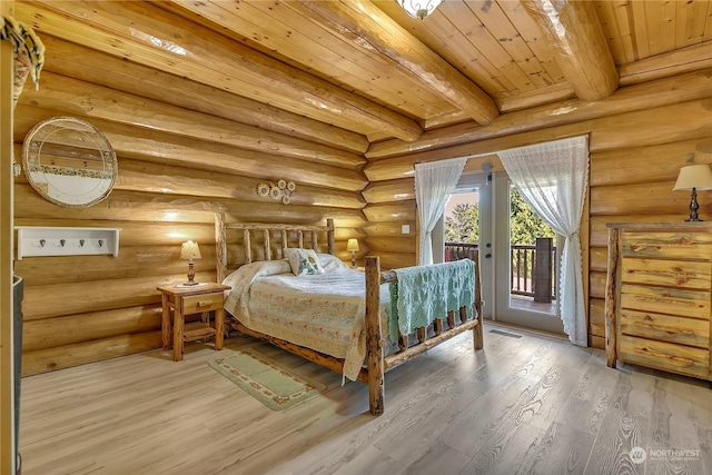 bedroom featuring hardwood / wood-style floors, wood ceiling, access to outside, and beamed ceiling