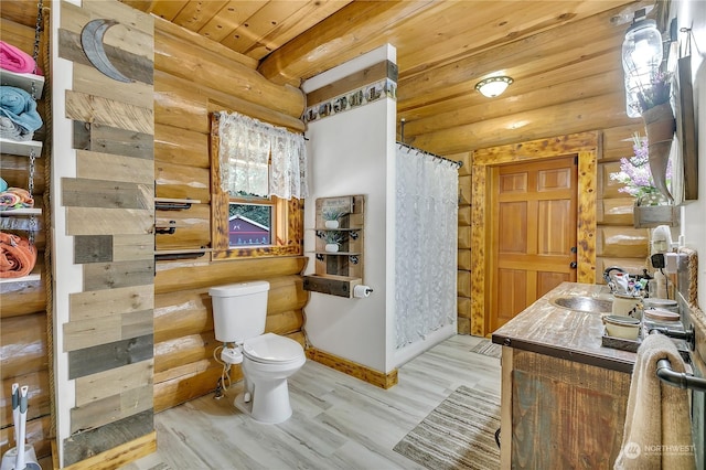 bathroom with hardwood / wood-style floors, curtained shower, vanity, toilet, and wooden ceiling