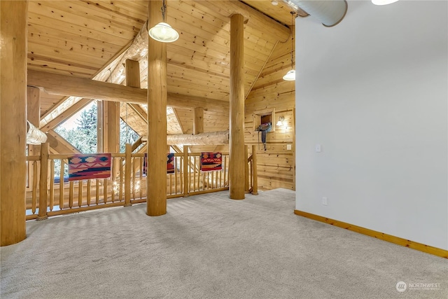 interior space with wood ceiling, lofted ceiling, and carpet floors