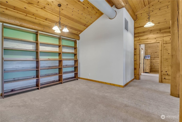 interior space with an inviting chandelier, wooden walls, high vaulted ceiling, carpet flooring, and wooden ceiling