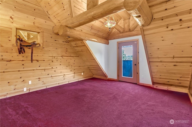 additional living space with carpet, vaulted ceiling with beams, wooden ceiling, and wooden walls