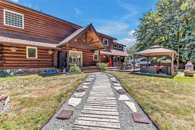 view of front of home featuring a gazebo, an outdoor hangout area, a front yard, and a patio