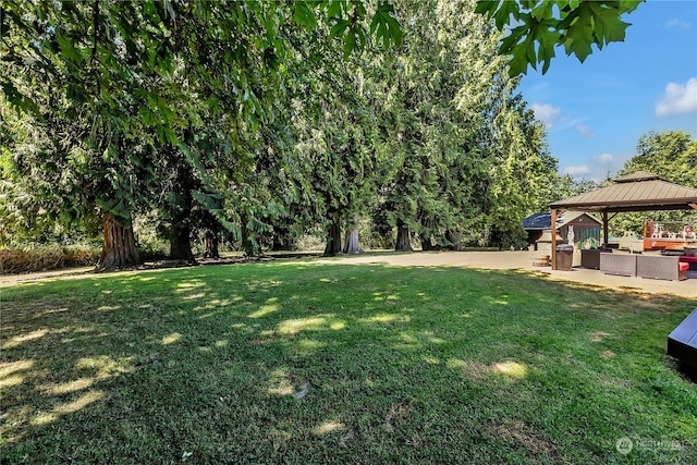 view of yard with a gazebo and outdoor lounge area