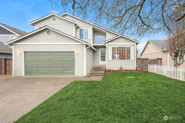 view of front of property with a garage and a front lawn