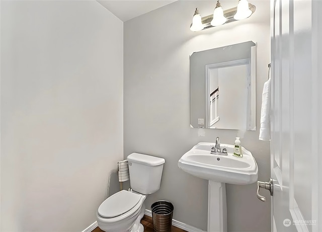 bathroom with sink and toilet