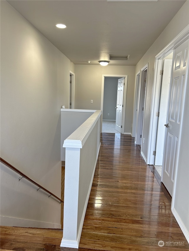 hallway featuring dark hardwood / wood-style flooring